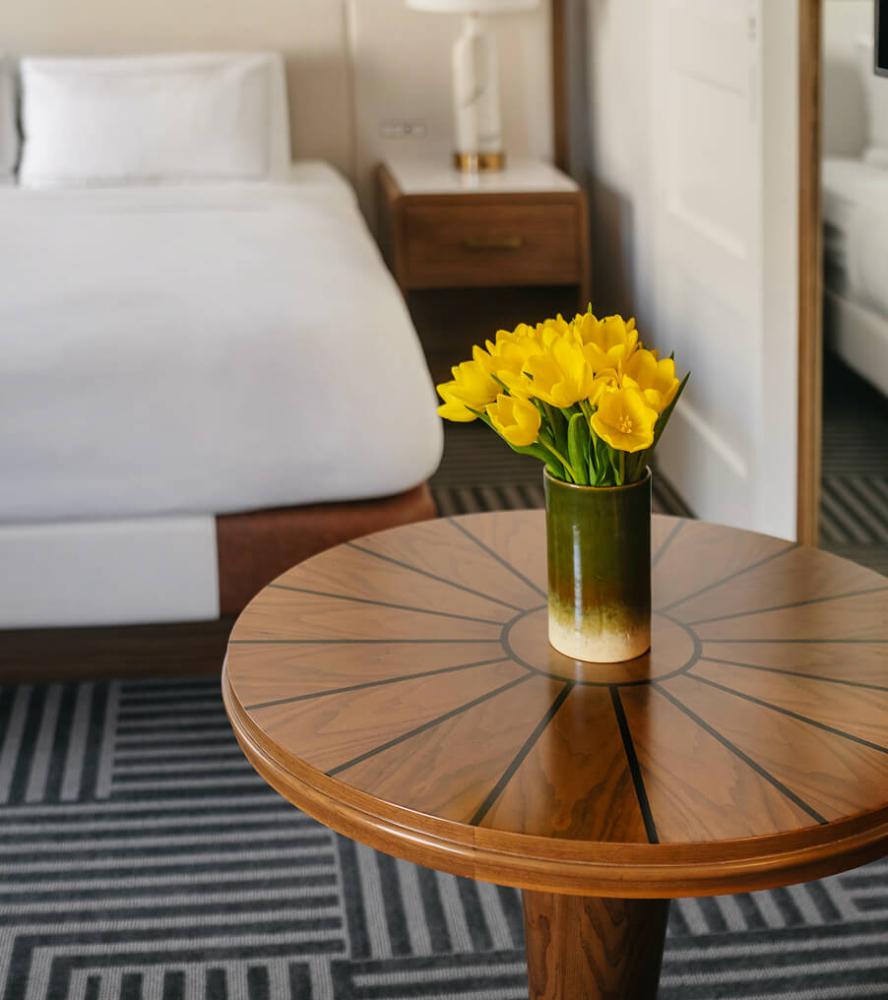 Elegant hotel round side table from top view in a Capital Hilton guestroom