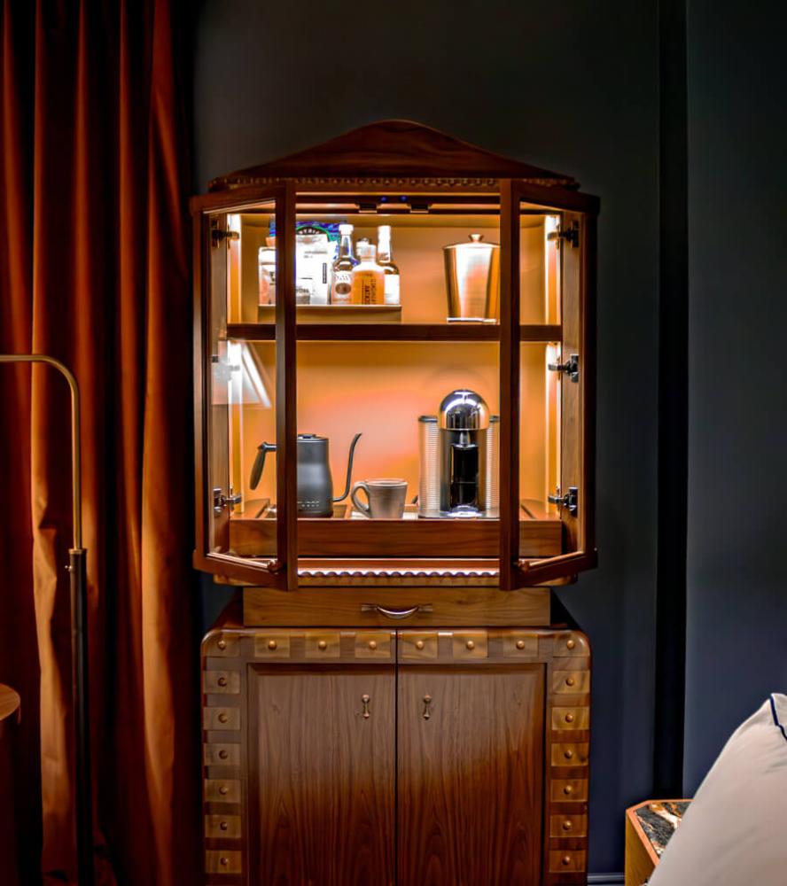 Bespoke cabinet with warm lighting and detailed trim at The Driskill Hotel
