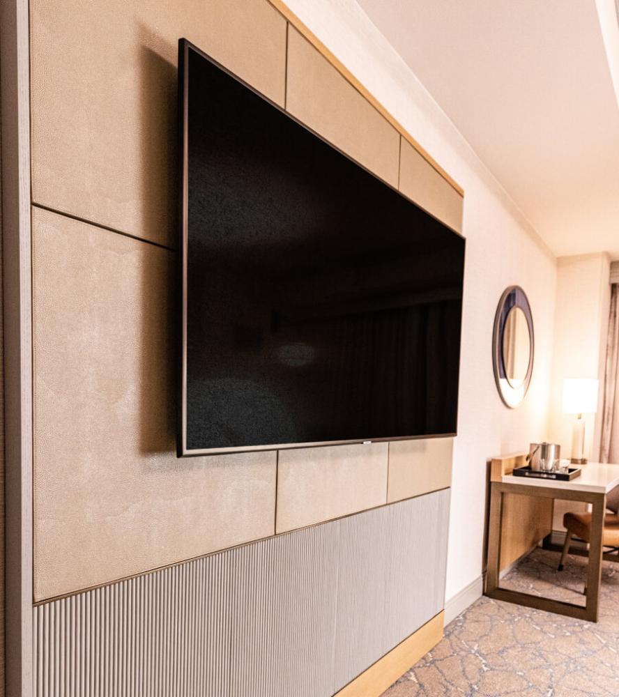 TV panel unit and desk in a guestroom at the Hilton Anatole hotel