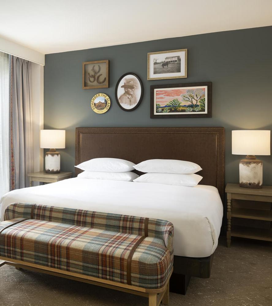 Comfortable and custom guestroom king bed wood headboard at Hyatt Regency Hill Country hotel
