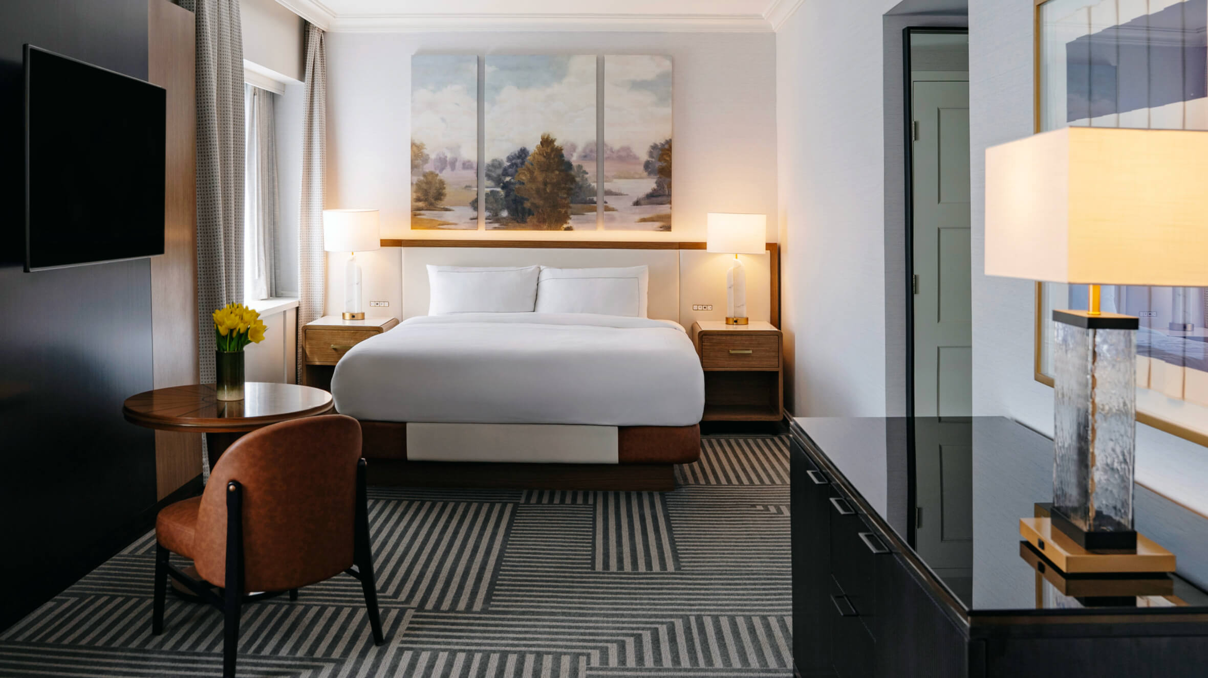 Capital Hilton guestroom renovation with modern Art Deco design and custom furniture
