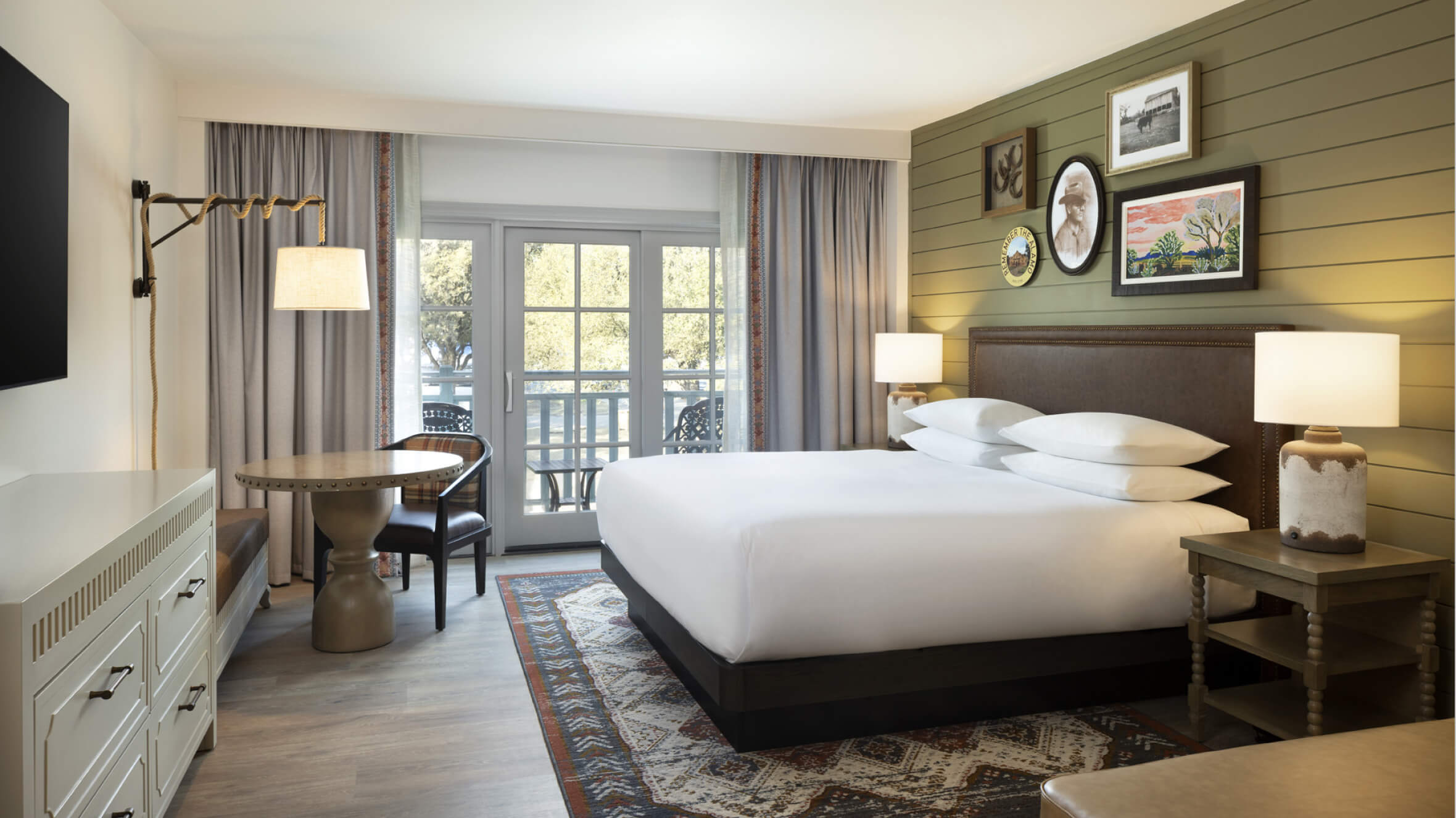 View in to King Bed guestroom renovation with rustic modern design at the Hyatt Regency Hill Country hotel