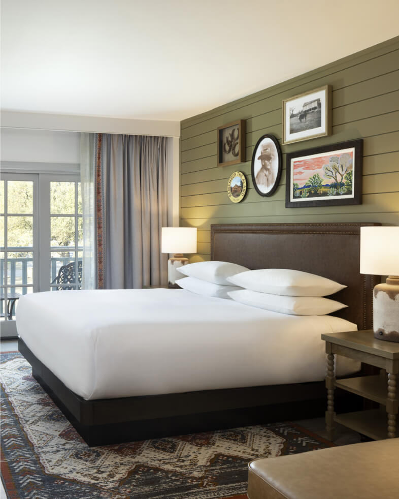 View in to King Bed guestroom renovation with rustic modern design at the Hyatt Regency Hill Country hotel