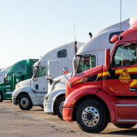 Semi trucks in a uniform line