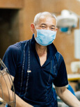 A worker in the factory smiling at the camera